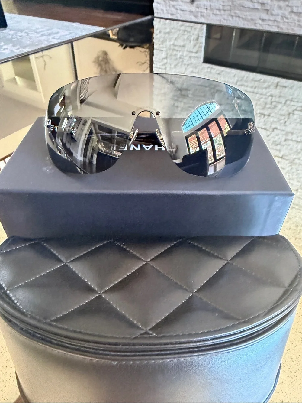 CHANEL Black Shield Sunglasses with Gold Logo Accents